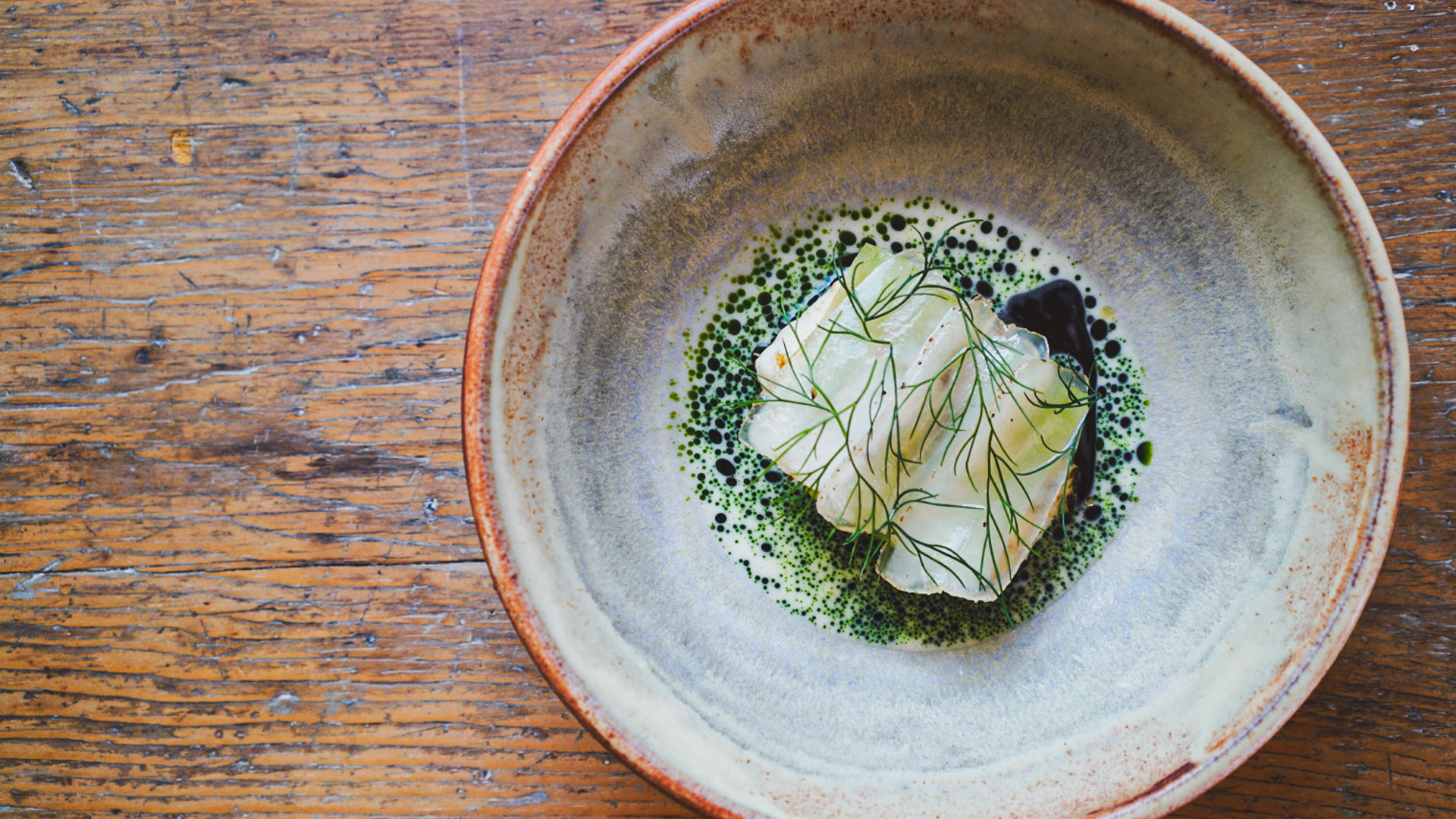 Table Doucet Halibut on a wood table